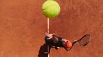 Tennis player setting himself up for a serve
